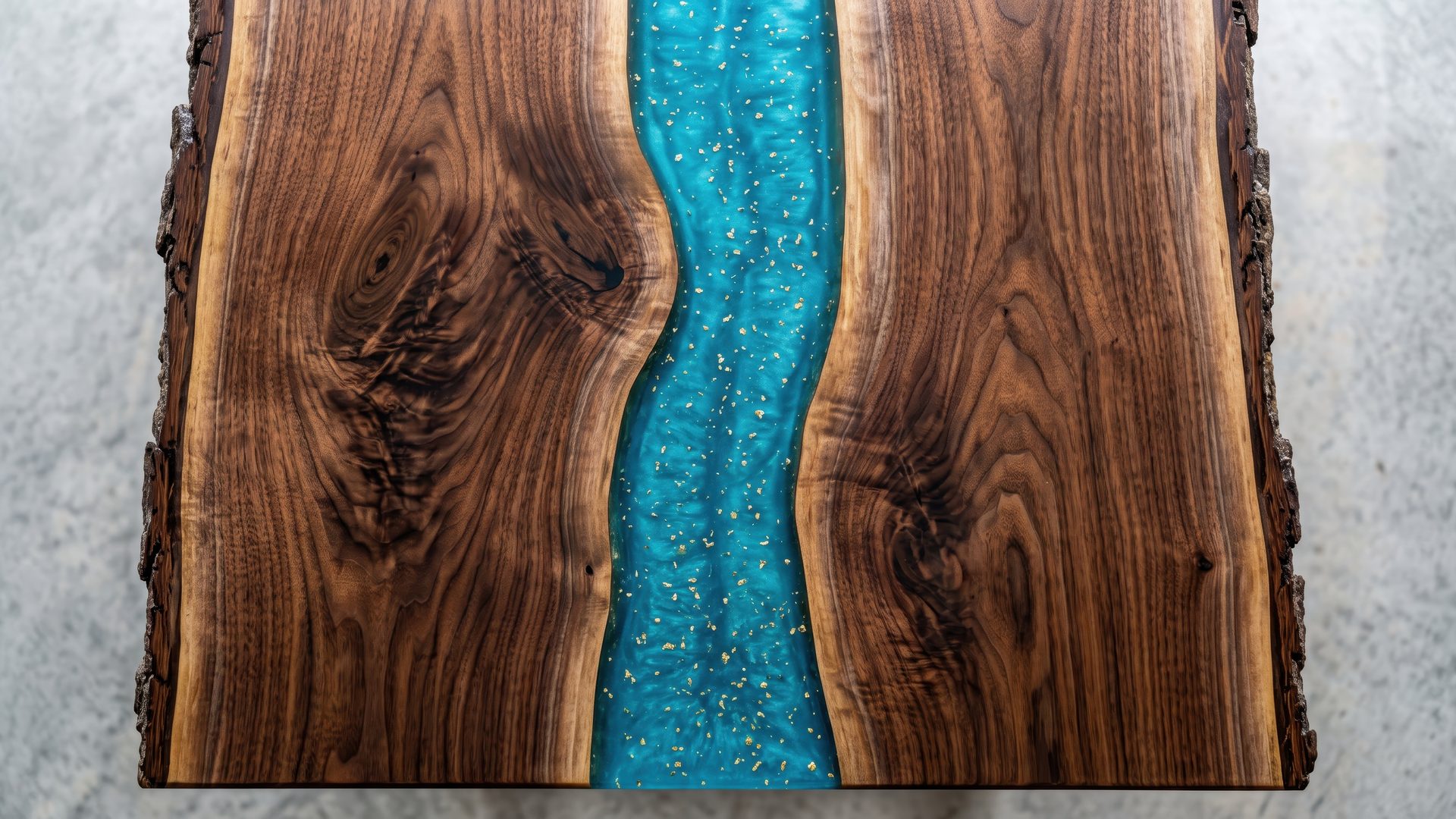 Live-edge black walnut slab with a turquoise resin river flecked with gold leaf